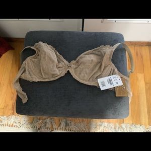 Brand new bra, never been worn. Slight lace with a pretty rhinestone bow.